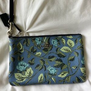 Blue floral patterned Coach clutch (medium sized)